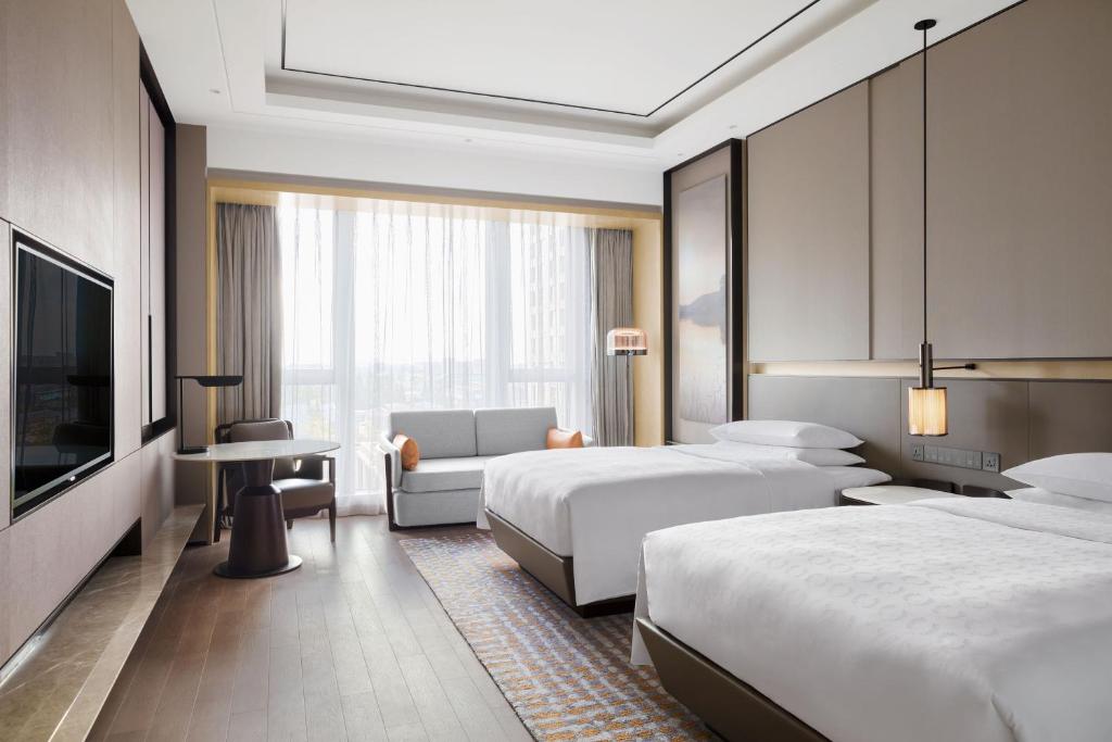 Postel nebo postele na pokoji v ubytování Sheraton Shanghai Fengxian