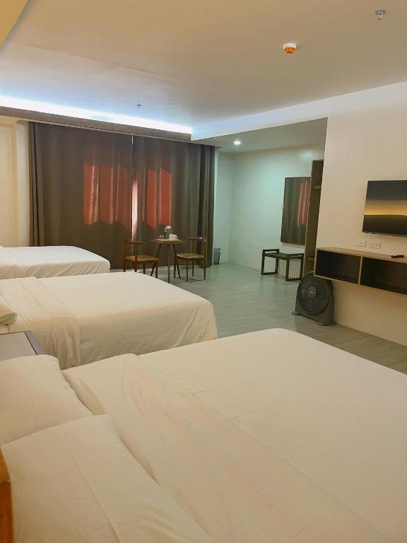 Postel nebo postele na pokoji v ubytování Soleo Inn