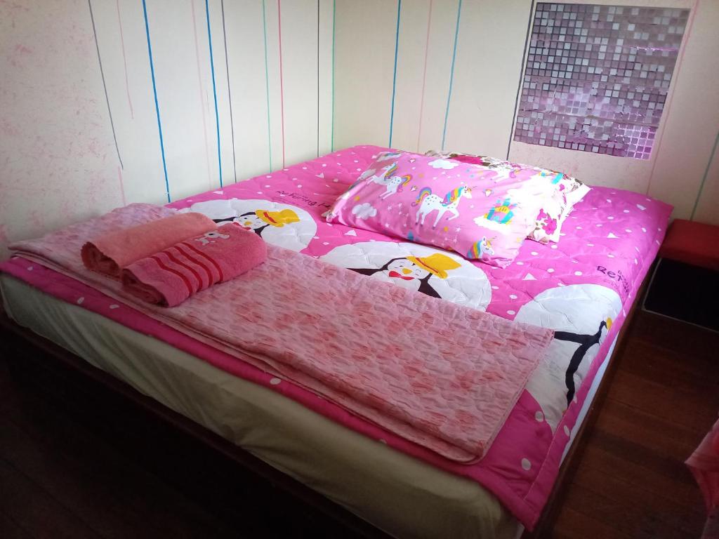 Postel nebo postele na pokoji v ubytování NP guesthouse