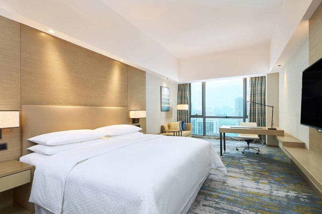 Postel nebo postele na pokoji v ubytování Four Points by Sheraton Jiaxing