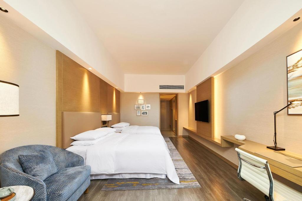 Postel nebo postele na pokoji v ubytování Four Points by Sheraton Jiaxing