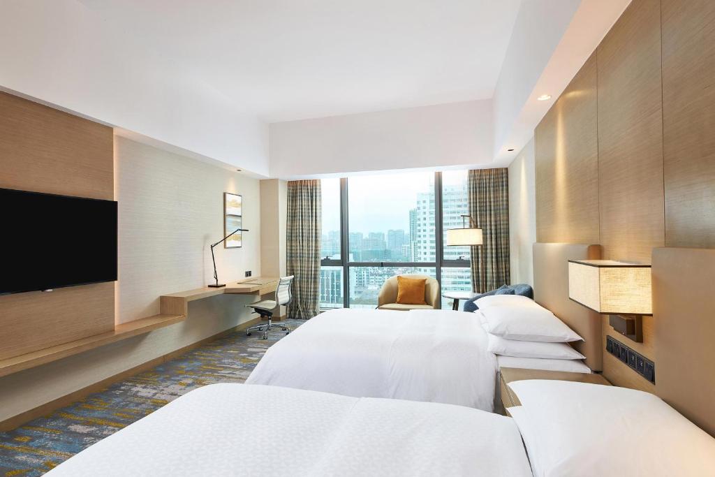 Postel nebo postele na pokoji v ubytování Four Points by Sheraton Jiaxing
