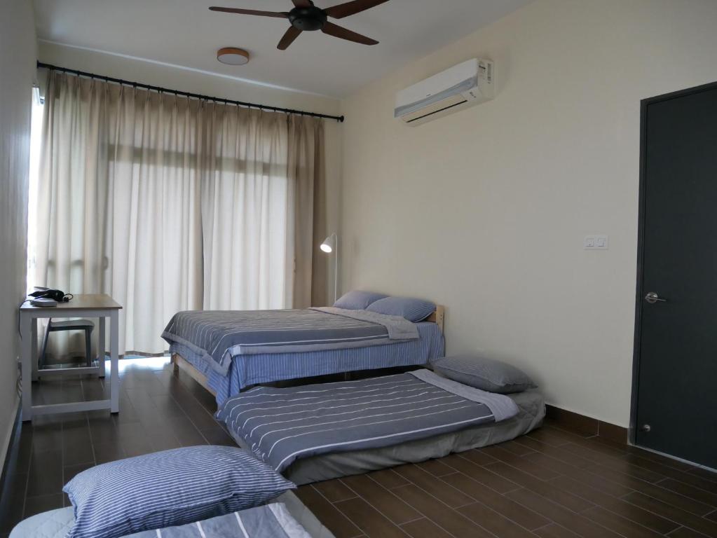 Postel nebo postele na pokoji v ubytování Jome Putrajaya Presint 8 Natural Homestay