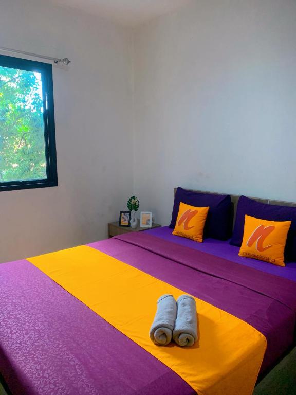 Postel nebo postele na pokoji v ubytování Residence Tanjung Pakuan