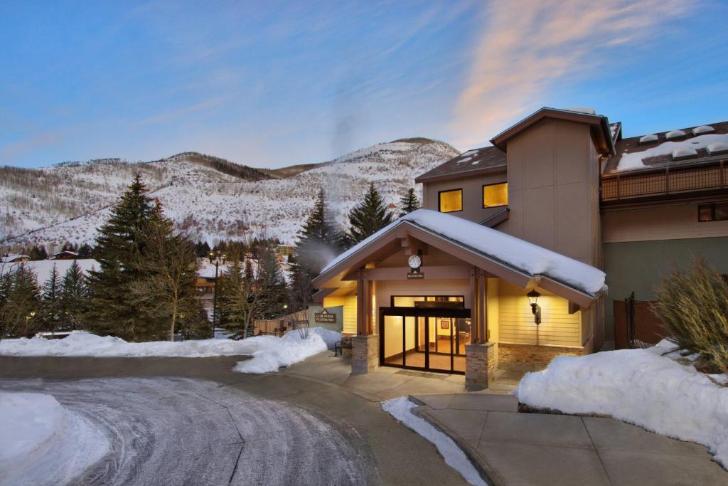 a house with snow on the side of it at Marriott's StreamSide Douglas at Vail in Vail