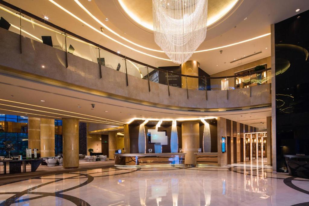 a lobby of a hotel with a chandelier at Renaissance Chengdu Hotel in Chengdu