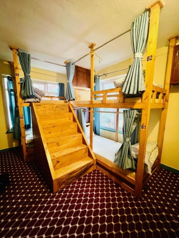 Postel nebo postele na pokoji v ubytování Kwabahal Boutique Hostel