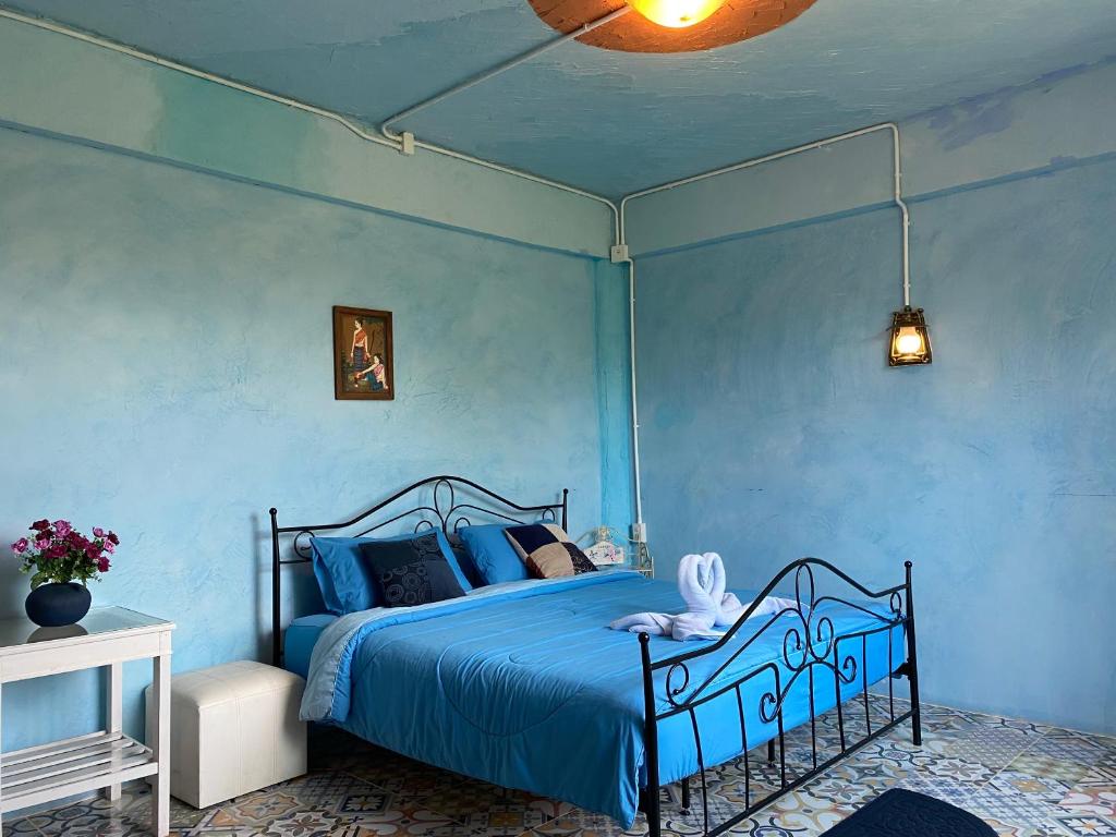 Postel nebo postele na pokoji v ubytování De Monte Khaokho