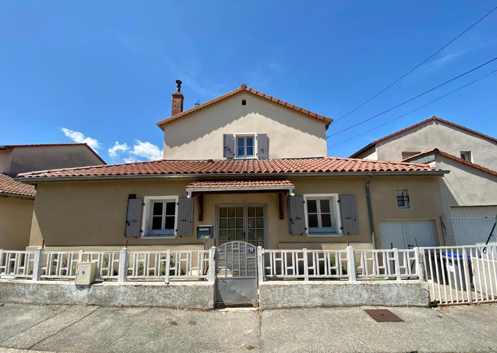 a house with a white fence in front of it at Le LOUIS 16 - Maison avec jardin in Valence