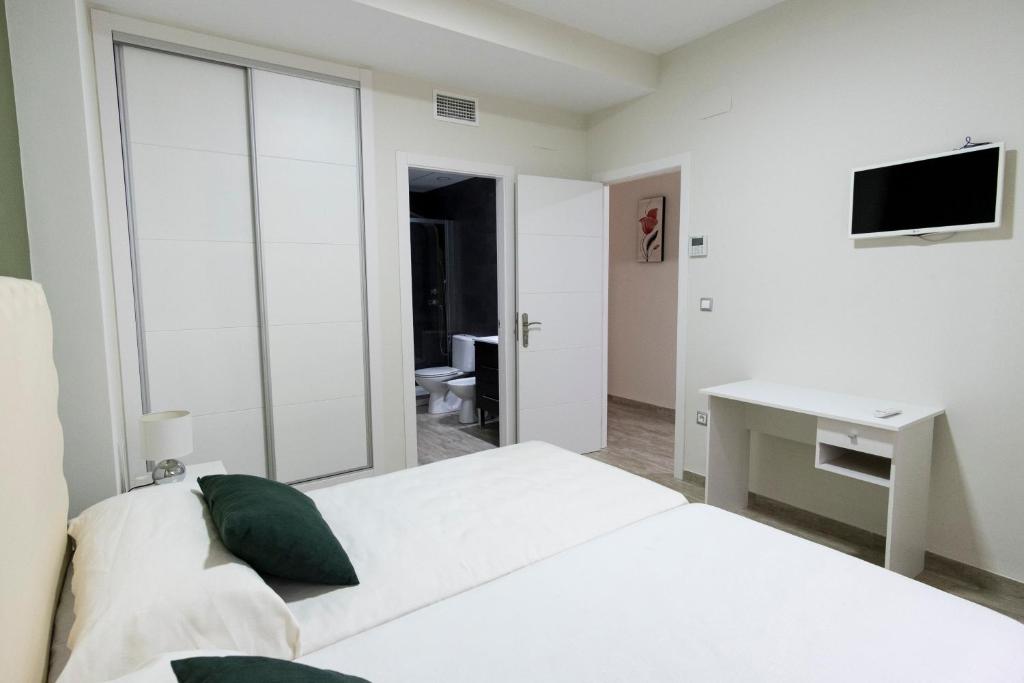 Postel nebo postele na pokoji v ubytování CASA CON PATIO