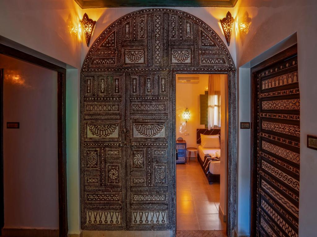 Postel nebo postele na pokoji v ubytování Riad Dar Sido