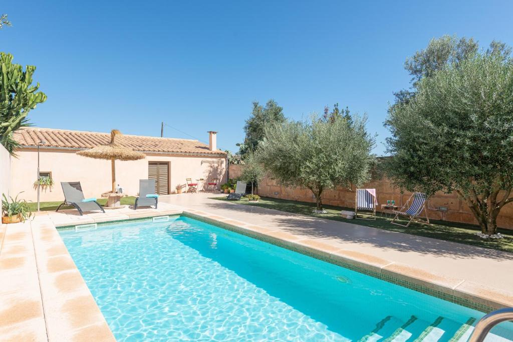 a swimming pool in front of a house at Ca Ses Nines in Ariany