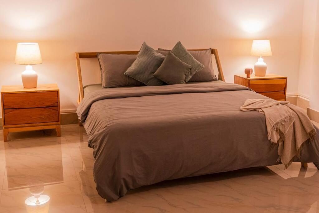 Ένα ή περισσότερα κρεβάτια σε δωμάτιο στο Sewaro Homestay, Vista Suite.