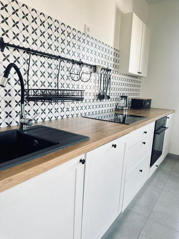 Kuchyň nebo kuchyňský kout v ubytování Śpij w Kudowie Apartament i pokoje gościnne