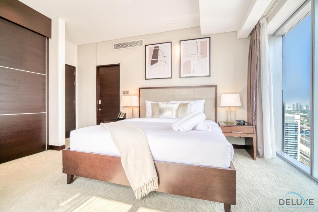 Postel nebo postele na pokoji v ubytování Premium 1BR at The Address Residences Dubai Marina by Deluxe Holiday Homes