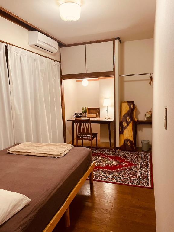 Postel nebo postele na pokoji v ubytování 海に恋する泊まれる喫茶店 ポパイ