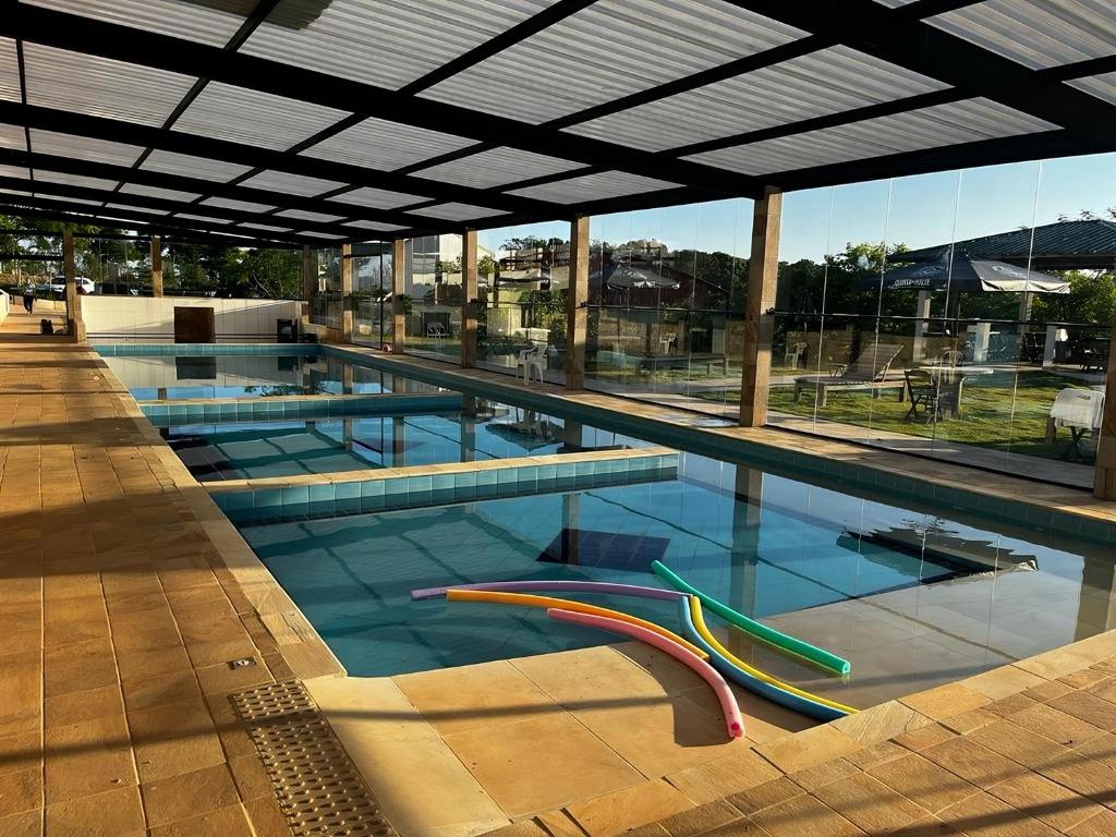 a large swimming pool with blue water at Hotel Fazenda Colina dos Sonhos in Socorro