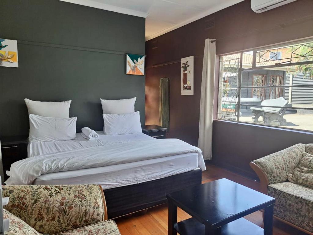 Кровать или кровати в номере Mino Guest House