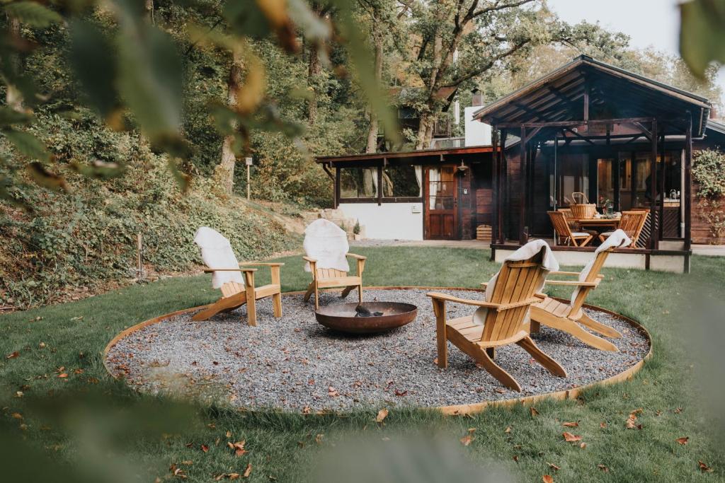 a group of chairs sitting around a fire pit at refuges in Beauraing