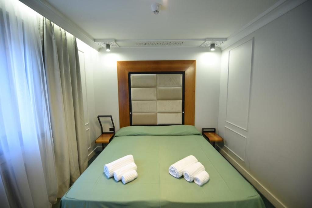 Postel nebo postele na pokoji v ubytování Hotel Celis