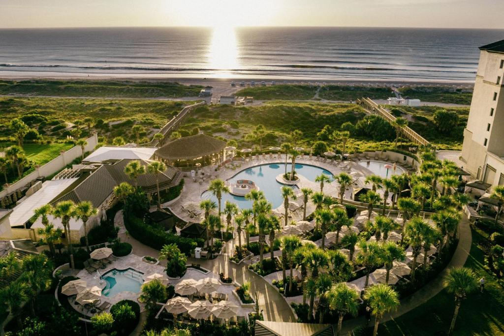 an aerial view of a resort with a pool and the ocean at The Ritz-Carlton, Amelia Island in Fernandina Beach