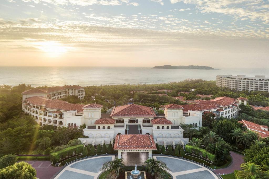 an aerial view of a resort with the ocean in the background at JW Marriott Sanya Haitang Bay Resort & Spa in Sanya