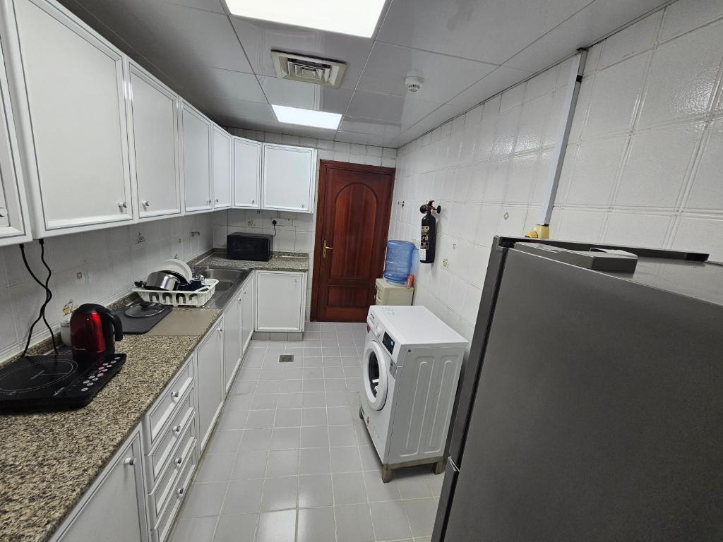 Kuchyň nebo kuchyňský kout v ubytování Oasis Hostel