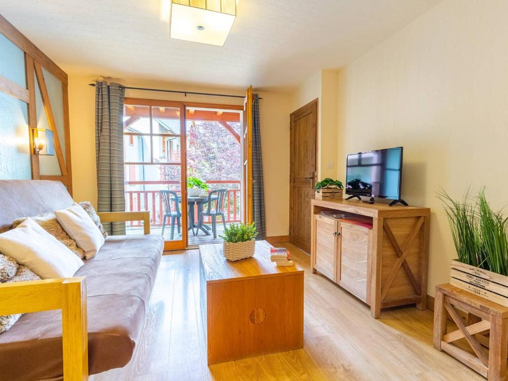 TV a/nebo společenská místnost v ubytování Appartement prestige centre-ville avec piscine, sauna, parking et ascenseur - FR-1-296-298