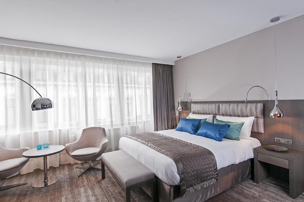Postel nebo postele na pokoji v ubytování Hotel Agenda Louise