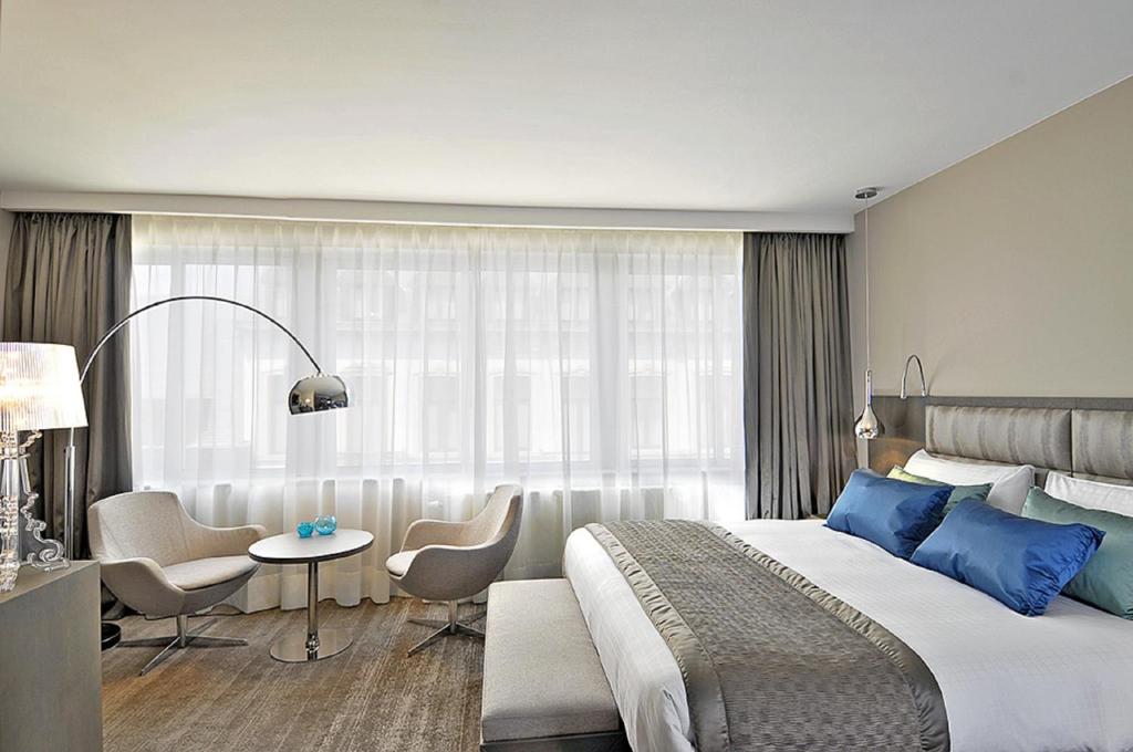 Postel nebo postele na pokoji v ubytování Hotel Agenda Louise