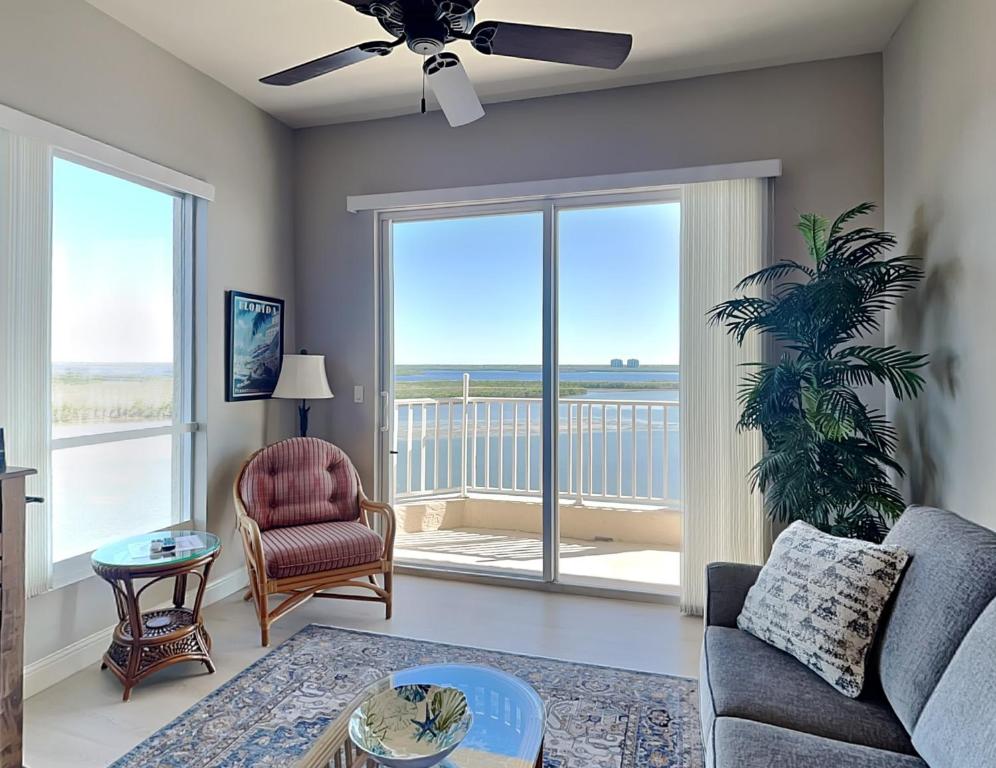 a living room with a view of the ocean at Lovers Key Resort Penthouse 3 in Fort Myers Beach