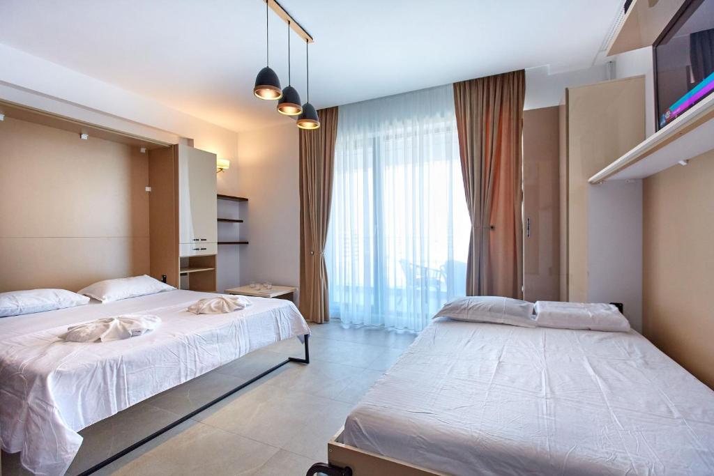 En eller flere senge i et værelse på Studio Panoramic Sea On