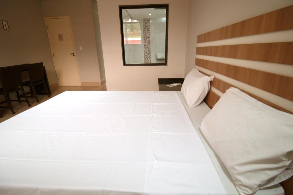 Postel nebo postele na pokoji v ubytování SP Jundiaí Hotel