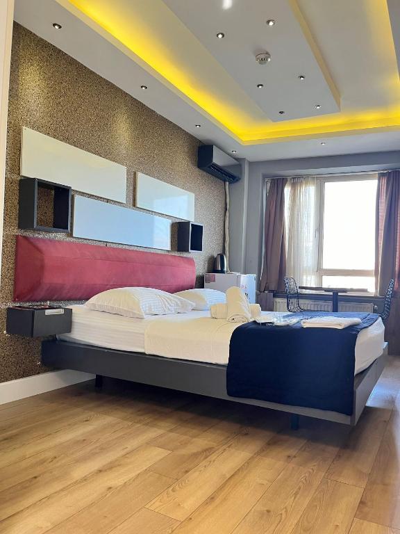 a bedroom with a large bed in a room at The Sisli Luxury Corner Suit in Istanbul