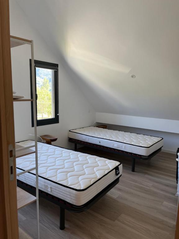 Postel nebo postele na pokoji v ubytování Le Sailhet