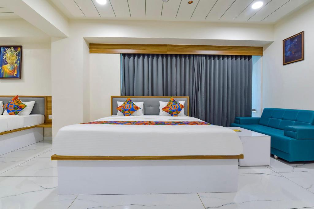 Postel nebo postele na pokoji v ubytování FabHotel Bliss