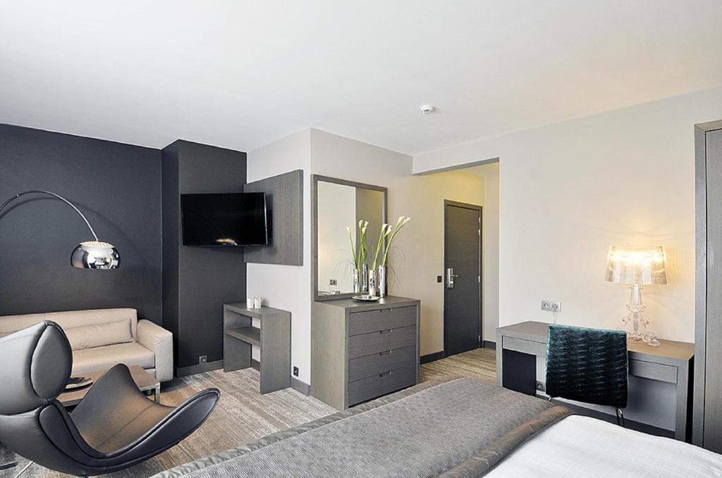 TV a/nebo společenská místnost v ubytování Hotel Agenda Louise