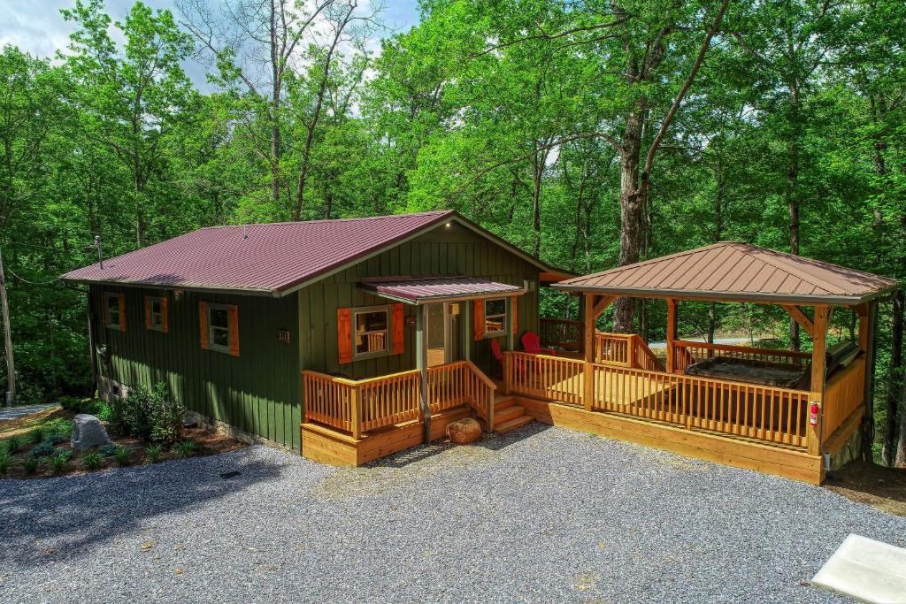 a green cabin with a porch and a gazebo at Beside Still Water 2 - 2 Bedrooms, 2 Baths, Sleeps 6 home in Cosby