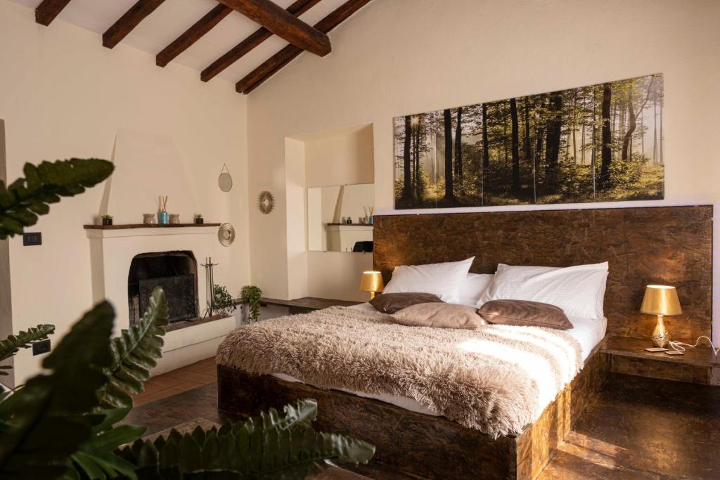 a bedroom with a bed with two pillows on it at Maison Chanely in Calcata