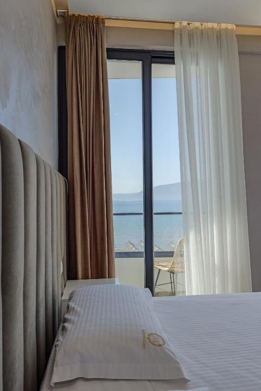 Postel nebo postele na pokoji v ubytování Sea & Sand Hotel