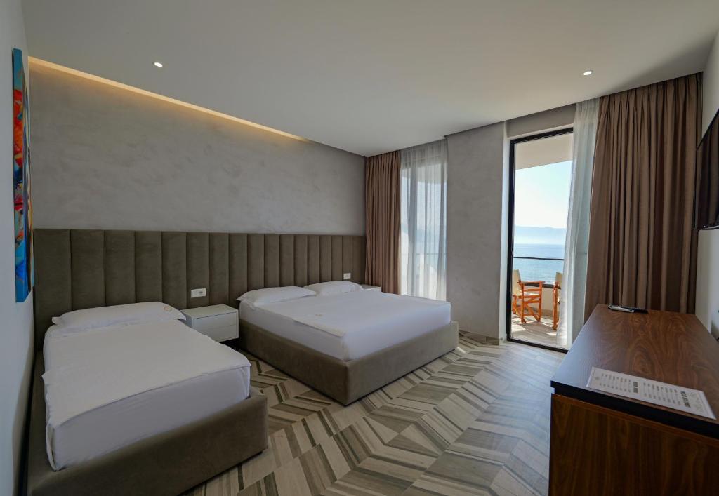 Postel nebo postele na pokoji v ubytování Sea & Sand Hotel