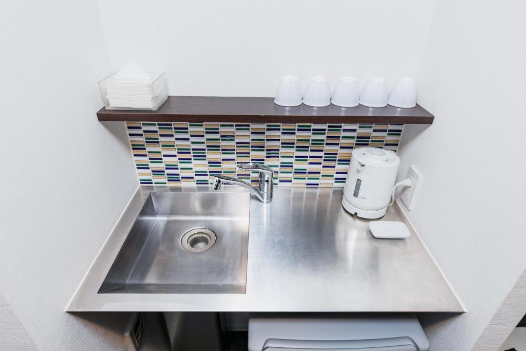 Kuchyň nebo kuchyňský kout v ubytování HOTEL ECCLESIA