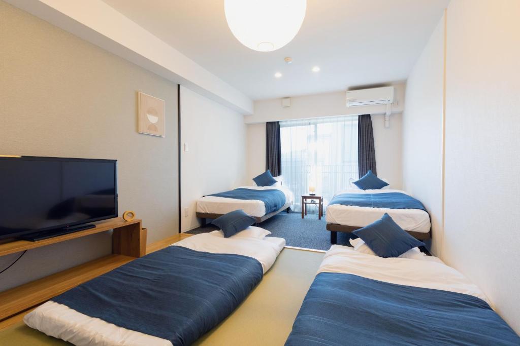 Postel nebo postele na pokoji v ubytování HOTEL ECCLESIA
