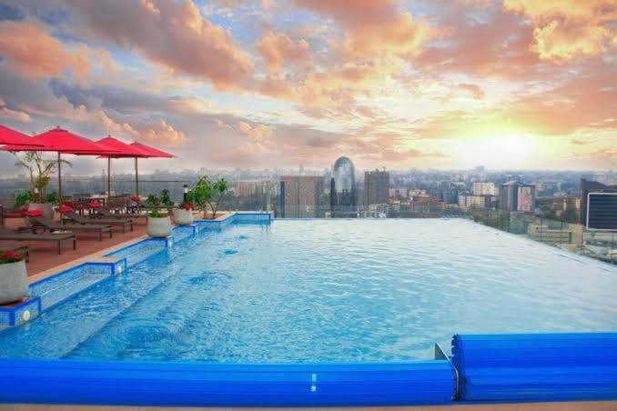 a large swimming pool on top of a building at Skynest Residences Entire Furnished Apartment, Westlands in Nairobi