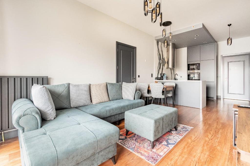 a living room with a couch and a table at Benesta Taksim No.8 in Istanbul