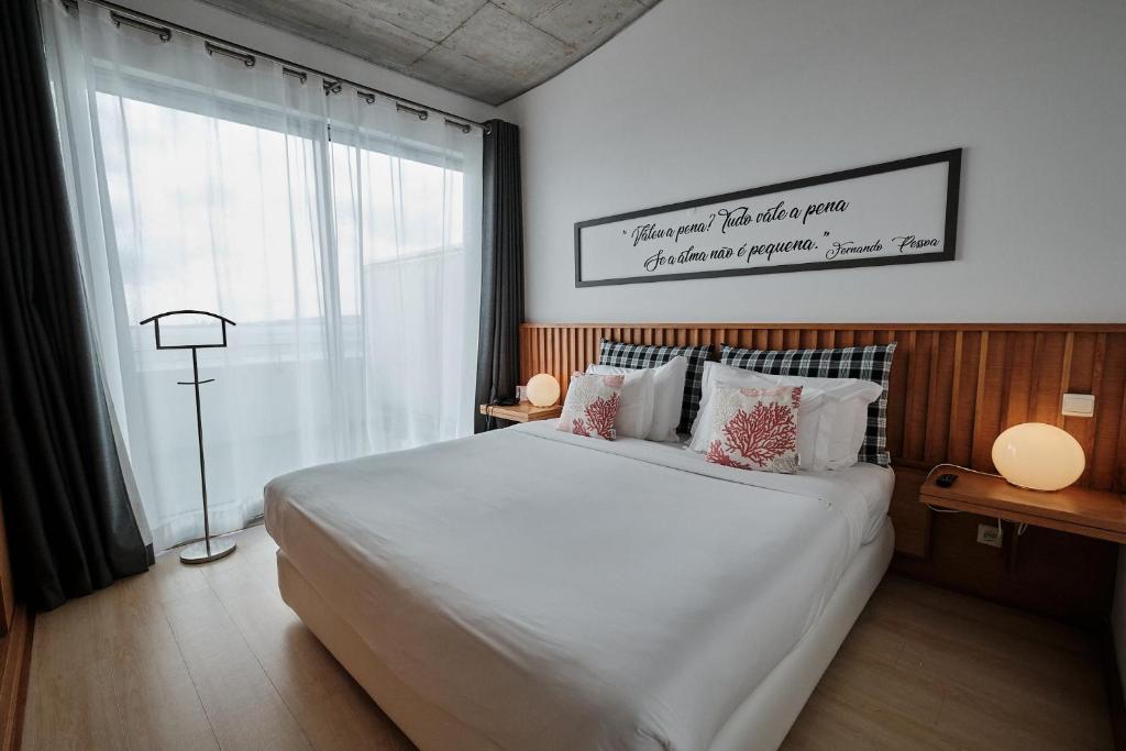 Кровать или кровати в номере Hotel Praia Marina by RIDAN Hotels