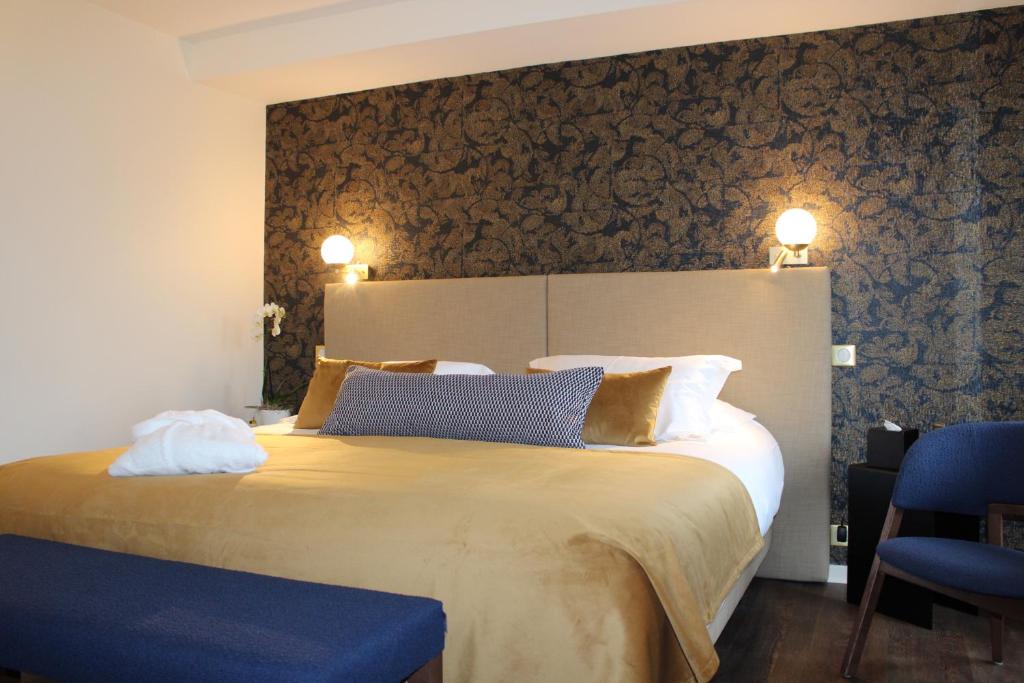 Postel nebo postele na pokoji v ubytování Hôtel La Truffe Noire