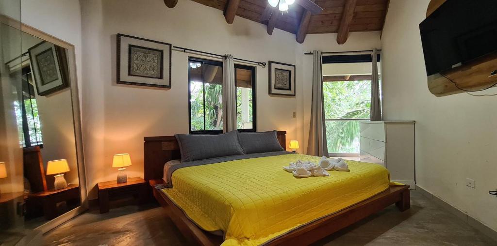 Postel nebo postele na pokoji v ubytování Vista Coiba Villas & Restaurant