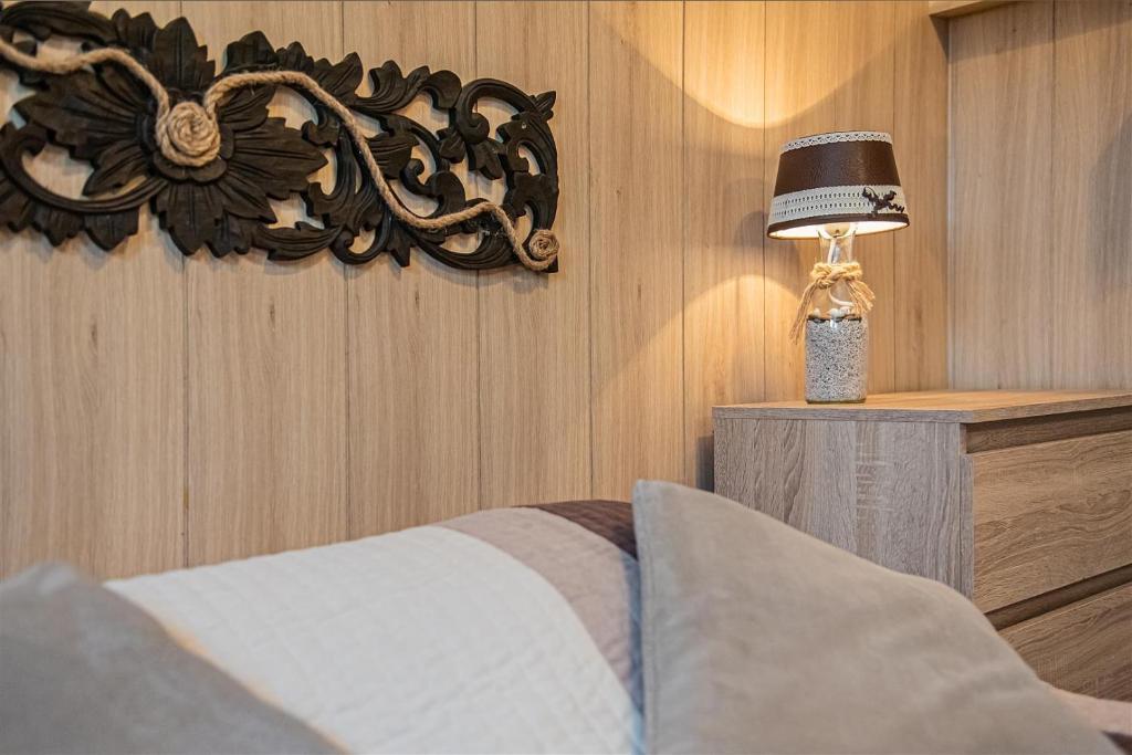 Postel nebo postele na pokoji v ubytování PROMYK - Apartamenty & Pokoje - dla dorosłych