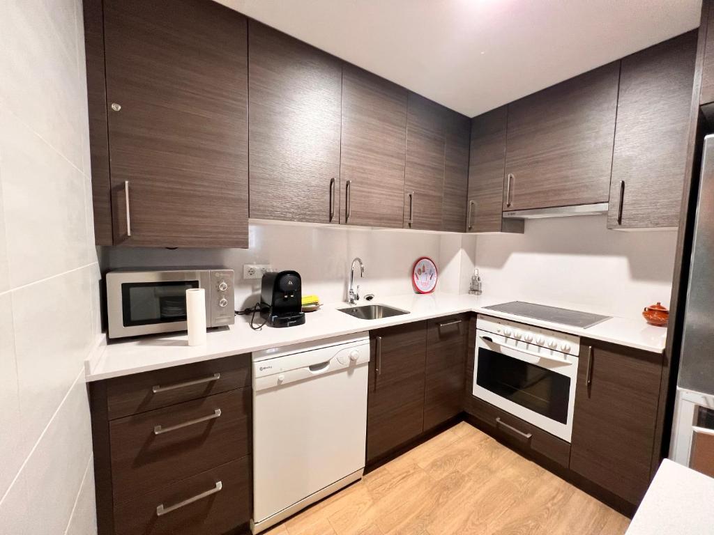 Kuchyň nebo kuchyňský kout v ubytování Apartamentos Casa Roldan